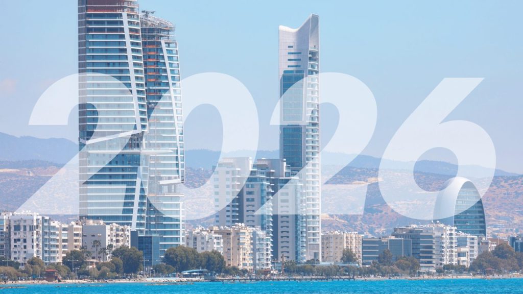 Cyprus tech startup founders collaborating in a modern coworking space overlooking the Mediterranean Sea