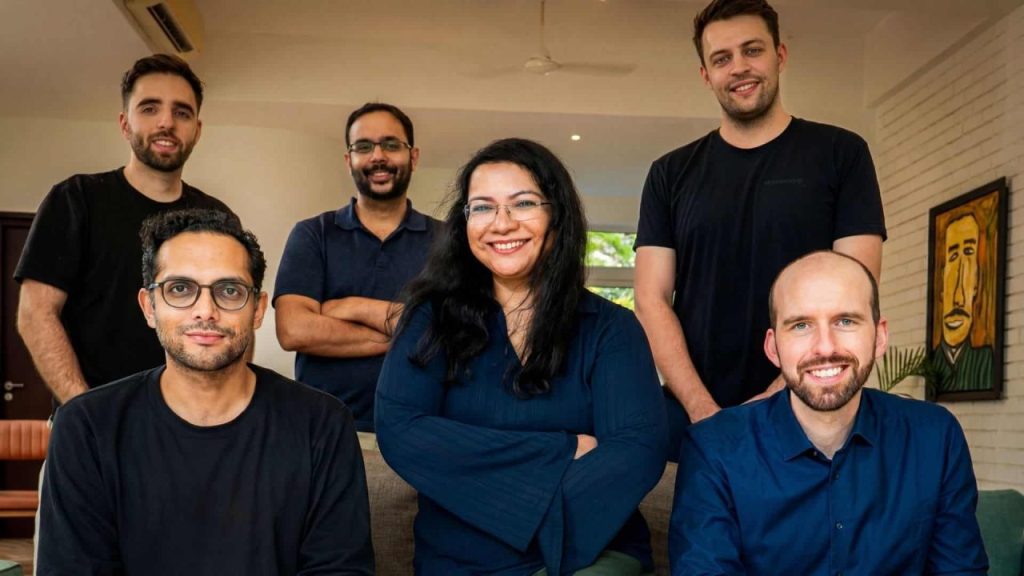 Developers in a modern Berlin office working on an AI system integrated with enterprise ERP dashboards