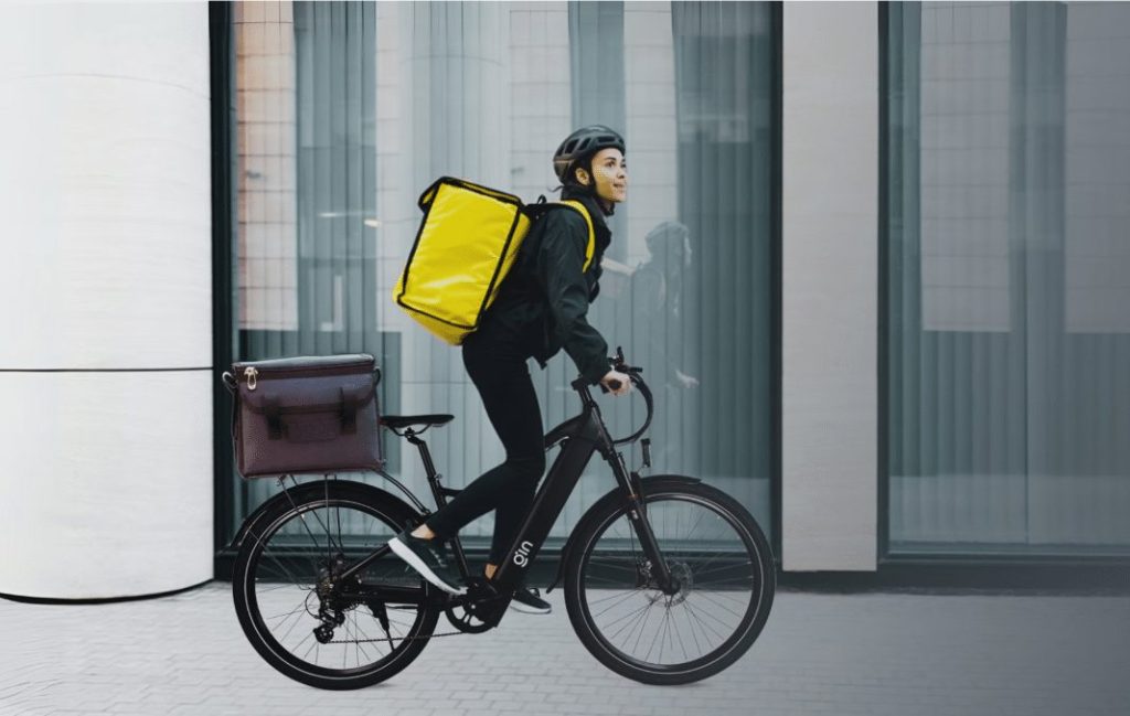 Row of PLUTO e-bikes from GIN e-bikes lined up on a London street, ready for subscription riders