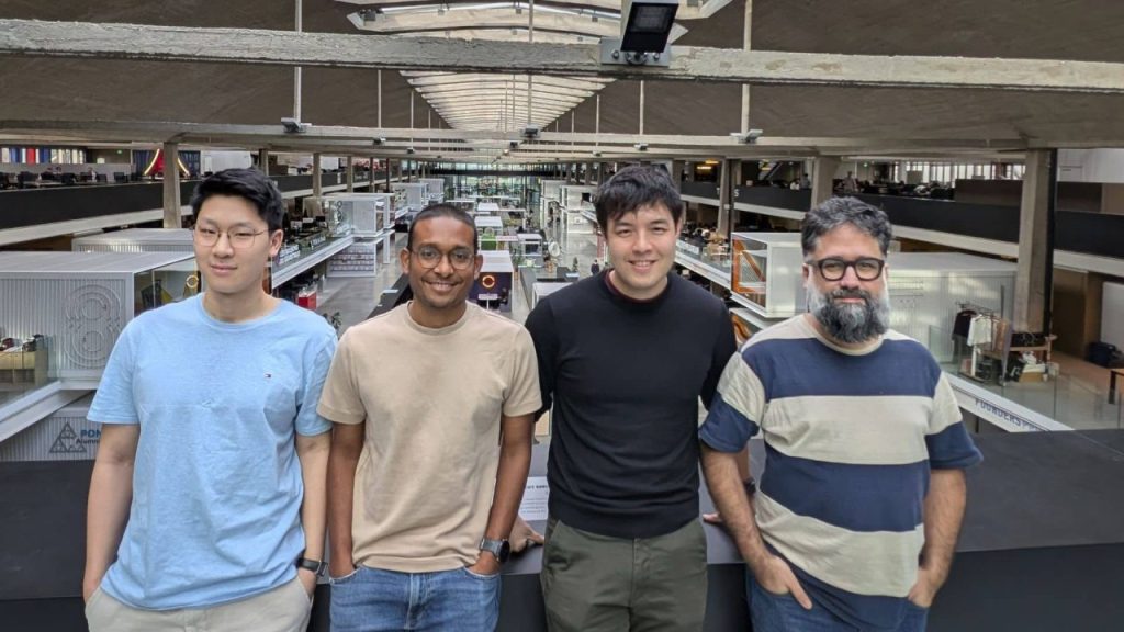 Team of GoCanopy working on an AI operating system dashboard for institutional real estate investors in a modern office