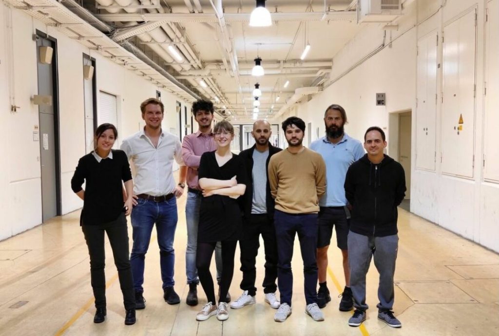 VitreaLab engineering team working on AR glasses light engine prototypes in a Vienna optics laboratory