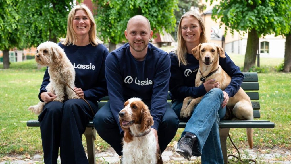 Lassie InsurTech mobile app displayed on a smartphone beside a dog, symbolizing prevention-first pet insurance
