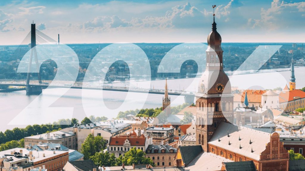 Latvian startup founders collaborating in a modern tech office in Riga