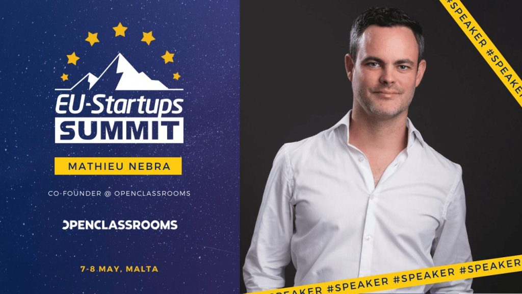 OpenClassrooms co-founder Mathieu Nebra speaking on stage at a European startup conference