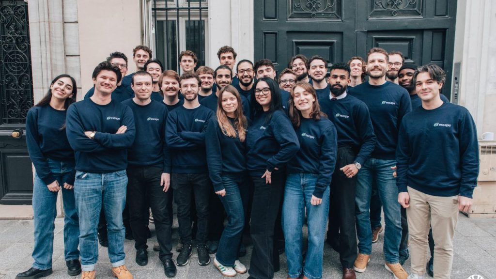 Escape secures $18M from Balderton to power AI cyber agents Developers monitoring AI-powered cybersecurity dashboards in a dark operations center