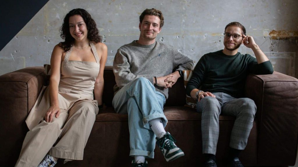 Team at London-based startup First Concepts collaborating on AI-powered creative pitch software in a modern office
