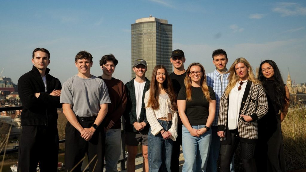 HYROX athletes competing in an indoor functional fitness race as ROXFIT develops an AI training platform