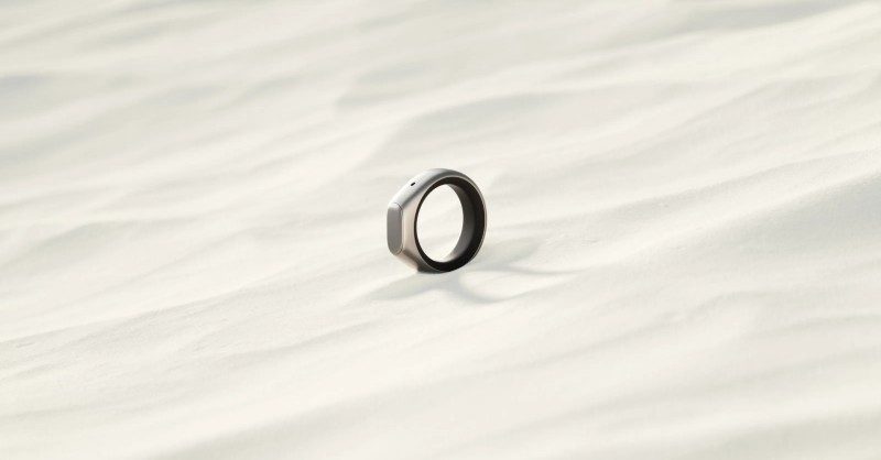 Sandbar, founded by ex‑Meta duo, raises $23M for smart rings Close-up of a smart ring on a person’s hand while writing notes in a notebook