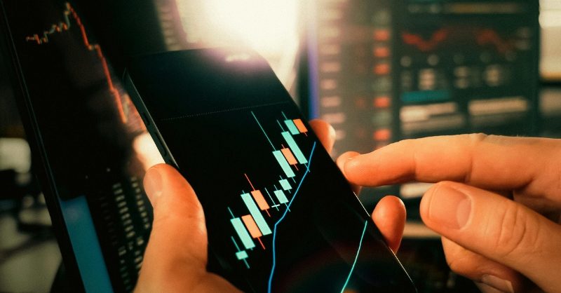 Software Risk Analysis: The Hidden Backbone of Stable Projects Developers reviewing software risk analysis charts on multiple monitors in a modern office