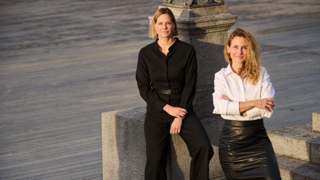 Female-led venture capital team discussing climate tech investments around a table