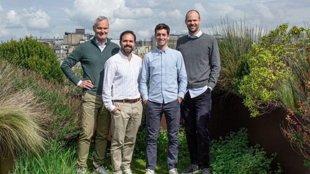 Decade Energy logo with a backdrop of an electric vehicle depot.
