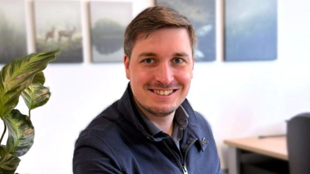 Exergy3 logo with industrial background representing renewable energy solutions.