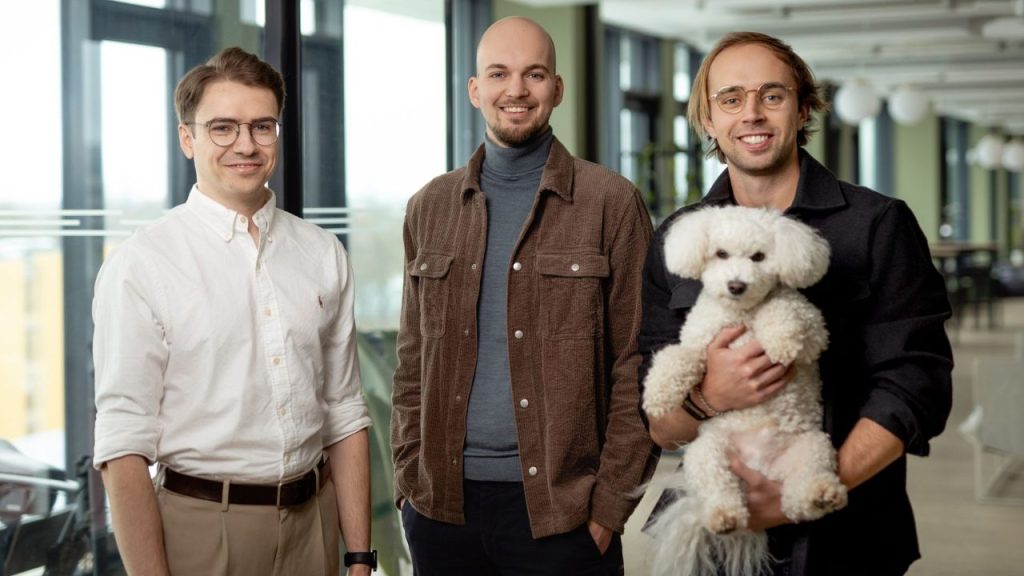 Two business professionals using an AI-powered dashboard to manage software buying and vendor contracts in a modern office