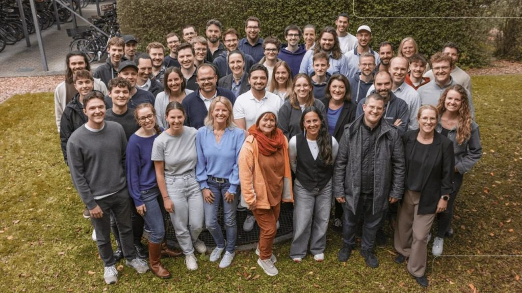 Nesto raises €11M to boost AI workforce tools for hotels Team members in a modern hotel operations office using an AI-powered workforce management dashboard on multiple screens