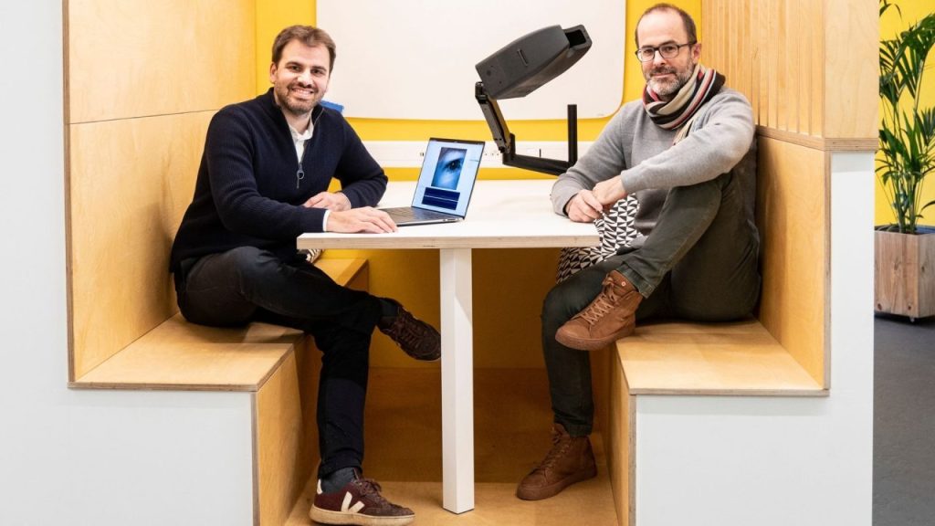 Medical professional using an AI-powered eye-tracking device for early neurological diagnosis in a clinical setting