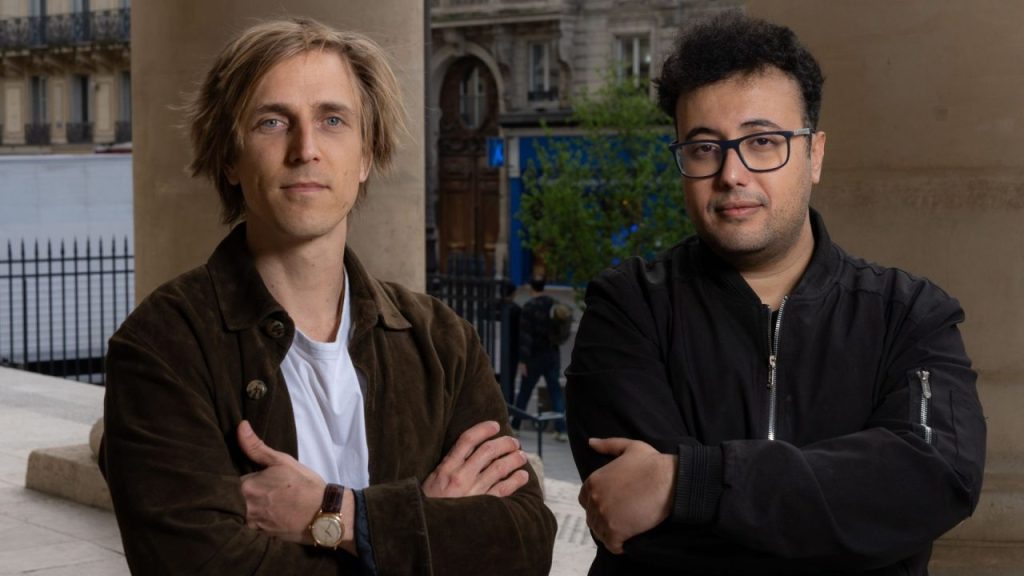 Business executives reviewing AI-powered decision intelligence dashboards in a modern Paris office