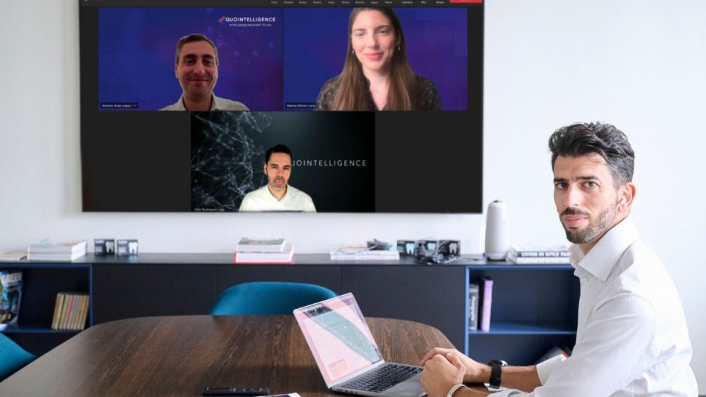 QuoIntelligence logo with a background of cybersecurity graphics