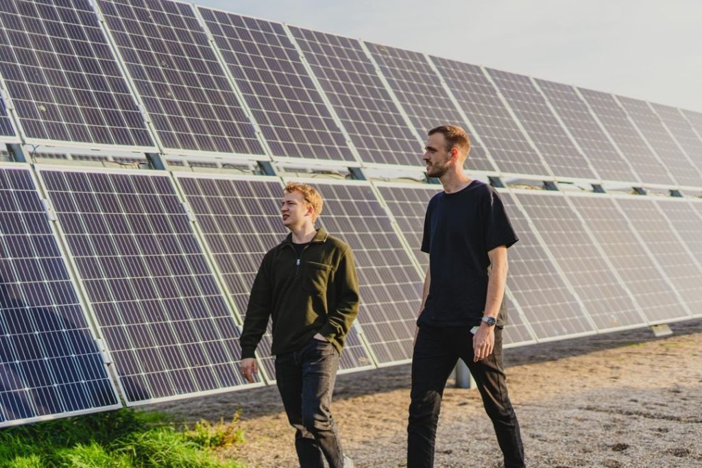 Copenhagen skyline with renewable energy sources like wind turbines and solar panels