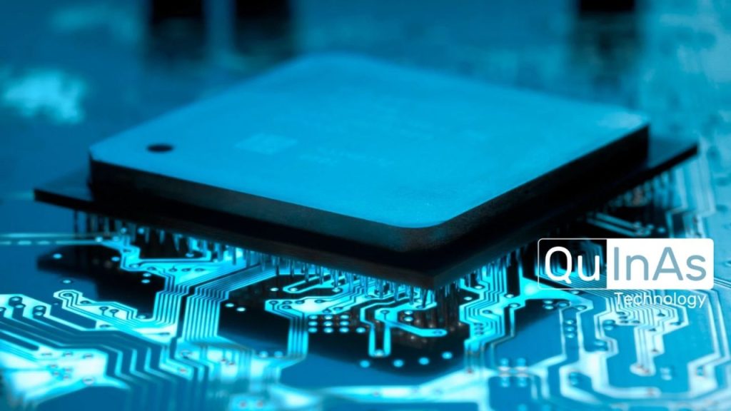 Quinas Technology logo with a backdrop of semiconductor circuits